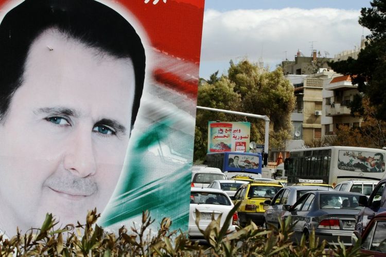Le portrait du président syrien, Bachar al-Assad, à Damas, le 4 mars.