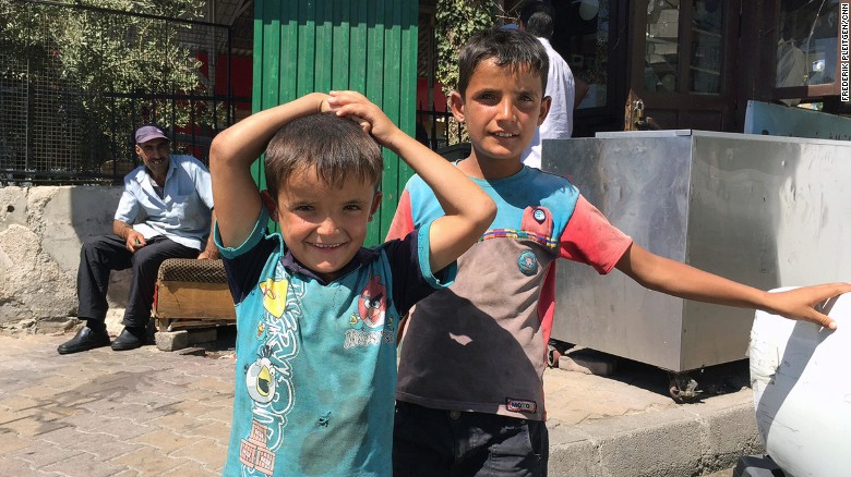 Ali, 5, and his brother Alla, 9, fled with their family to Damascus when their home in Idlib was destroyed by fighting. People in the capital are trying to maintain some sense of normalcy despite the ongoing war.