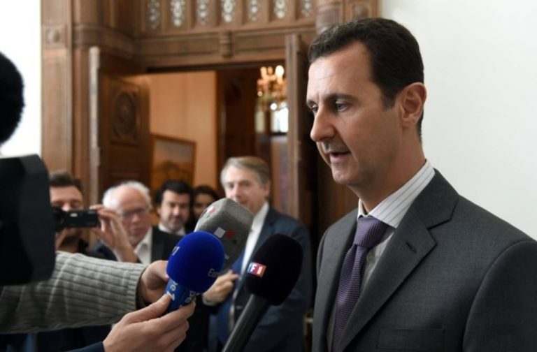 A handout image obtained from the official facebook page of Syrian Presidency shows Syrian President Bashar al-Assad speaking to the press following a meeting with a delegation of French lawmakers in Damascus on November 14, 2015. Assad said that French policy had contributed to the "spread of terrorism" that culminated in attacks claimed by the Islamic State group which killed 128 people in Paris. AFP PHOTO / HO / THE OFFICIAL FACEBOOK PAGE OF THE SYRIAN PRESIDENCY == RESTRICTED TO EDITORIAL USE - MANDATORY CREDIT "AFP PHOTO / HO / THE OFFICIAL FACEBOOK PAGE OF THE SYRIAN PRESIDENCY" - NO MARKETING NO ADVERTISING CAMPAIGNS - DISTRIBUTED AS A SERVICE TO CLIENTS ==