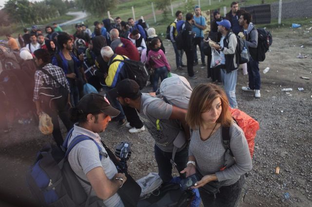 Luna Watfa (foreground, holding a phone) on her long journey to Germany after fleeing Syria. Following 63 days in detention, Watfa was rejected by members of her family. Fearing she would be arrested again, she crossed the border to Turkey with the help of a network of media activists. (Harry Shun)